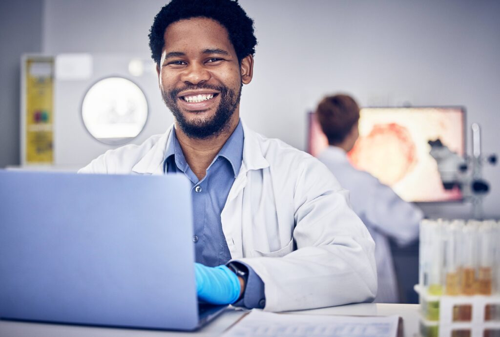 at, portrait scientist and black man with laptop lab utc